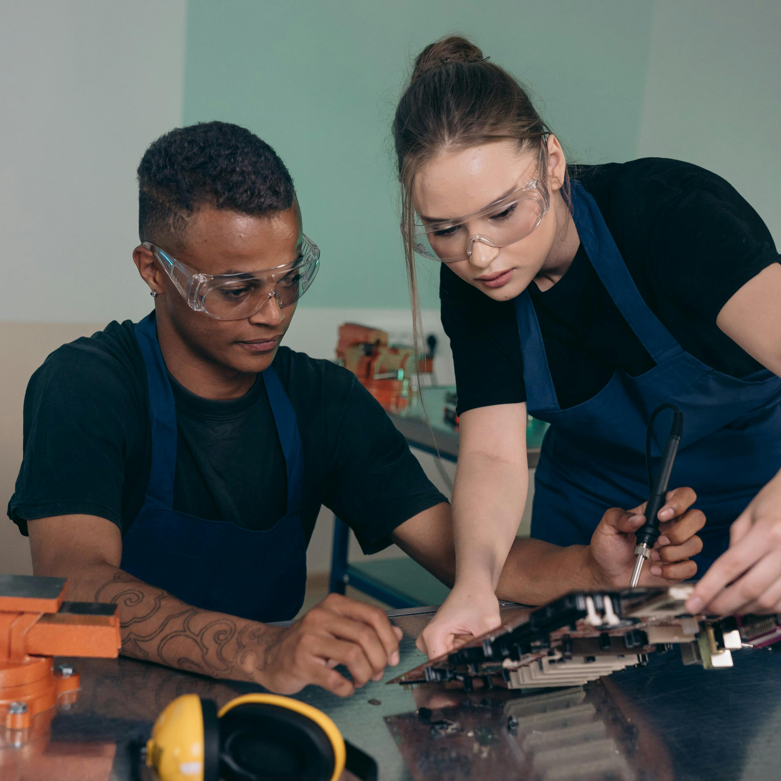 Two young adults working together